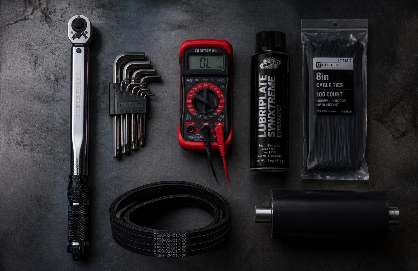 Engineering tools and treadmill components laid out on a workbench